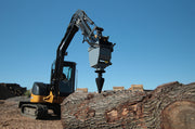 RSX380 on a Deere excavator, the cone entering the top of a large log