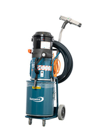 Dustcontrol DC 2900 H a dust extractor with a teal steel collection container, coiled hose and aluminium floor tool on a chrome suction pipe