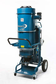 Dustcontrol DC 5900 c dust extractor, tall blue cyclone on a wheeled steel frame with an electrical enclosure at the side and a collection bag under the cone