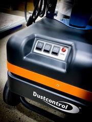 Close view of the DC Tromb 600 motor housing showing the rocker switch panel and the red filter indicator lamp