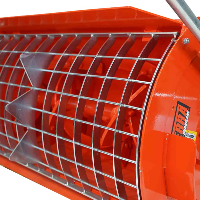Close-up through the steel mesh grate of the Hurricane mini mixer showing the orange internal mixing auger and paddles