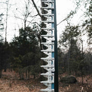 Close-up of the sickle bar showing the serrated triangular cutter sections bolted along the dark bar with their guards