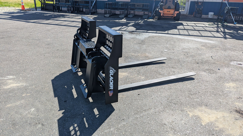 Glacier hydraulic pallet forks on pavement, angled view of the blades and hydraulic frame