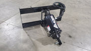 Glacier auger drive on a shop floor, three-quarter view showing the drive head, pivot arm, and open mounting frame