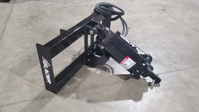 Glacier auger drive angled on a shop floor, showing the danger placard on the drive housing and the hex output shaft