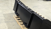 Glacier Extreme general-purpose bucket, three-quarter view on a pallet showing the shell and quick-attach plate