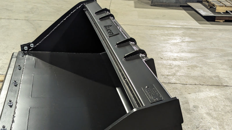Glacier Extreme general-purpose bucket, close angled view along the cutting edge and the weld-on shanks