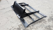 Glacier land plane on pavement from the opposite side, showing the frame rails, bolted bars, and mounting plate