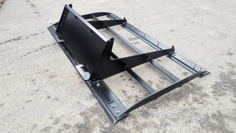 Glacier land plane on pavement from the opposite side, showing the frame rails, bolted bars, and mounting plate