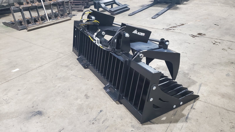 Glacier rock and brush grapple, side three-quarter view showing the reinforced frame, tines, and cylinders