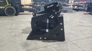 Glacier rock and brush grapple in a warehouse, angled view with the spiked tines facing forward