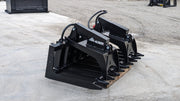 Glacier root and brush grapple on a pallet outdoors, angled view of the tine bar and the grapple arms