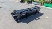 Glacier rotary tiller on pavement in a yard, rear view showing the hood, hose routing, and quick-attach plate