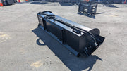 Glacier rotary tiller on pavement, three-quarter view showing the rotor housing and mounting frame