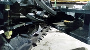 Glacier soil conditioner, close underside view of the drum, the drive shaft and the hydraulic lines