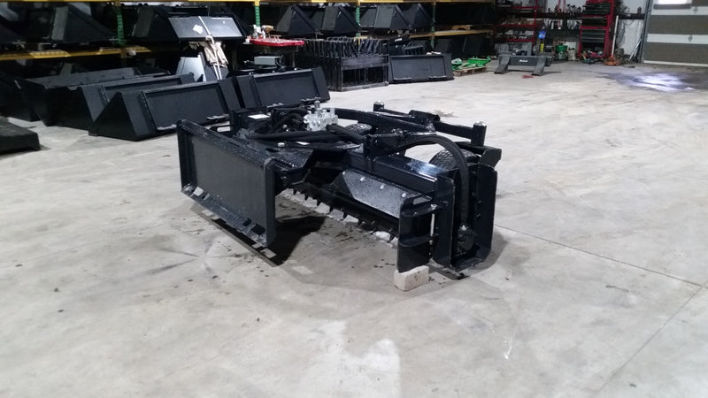 Glacier soil conditioner on a shop floor, angled view showing the drum face, teeth, and mounting frame