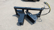Glacier tree puller on pavement from above, showing both serrated clamping edges and the frame
