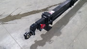 Close view of the Glacier truss boom tip on a shop floor, showing the pintle-style locking hook and safety pin