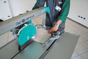 IMER Combicut 250/1000VA overhead rail tile saw, cutting a slab on a jobsite