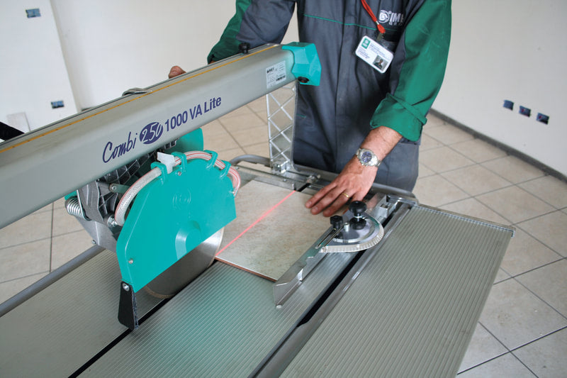 IMER Combicut 250/1000VA overhead rail tile saw, cutting a slab on a jobsite