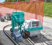 IMER Step-Up 120 towable mortar and grout pump, paired with a Mix 120 mixer on a jobsite