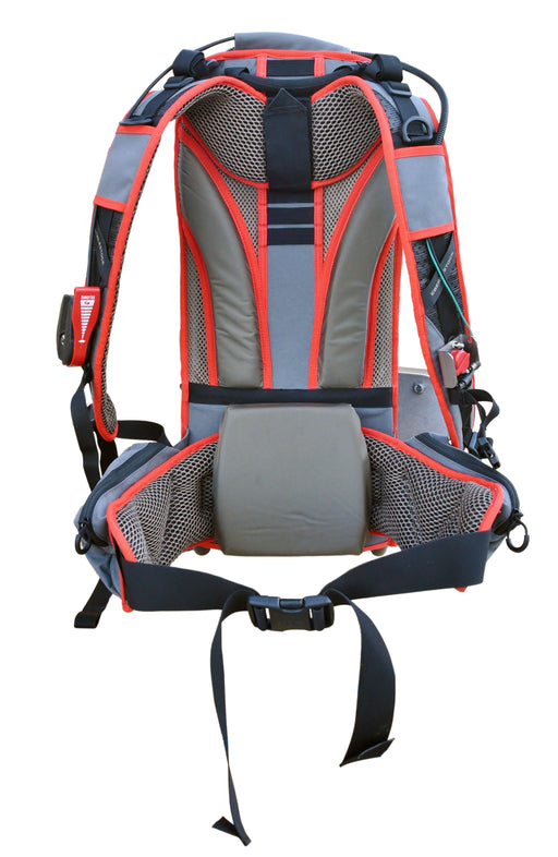 Multiquip BPX backpack concrete vibrator harness seen from the rear, red and grey breathable padding over the shoulders and lumbar pad, adjustable compression straps, and the throttle control mounted on the left shoulder strap