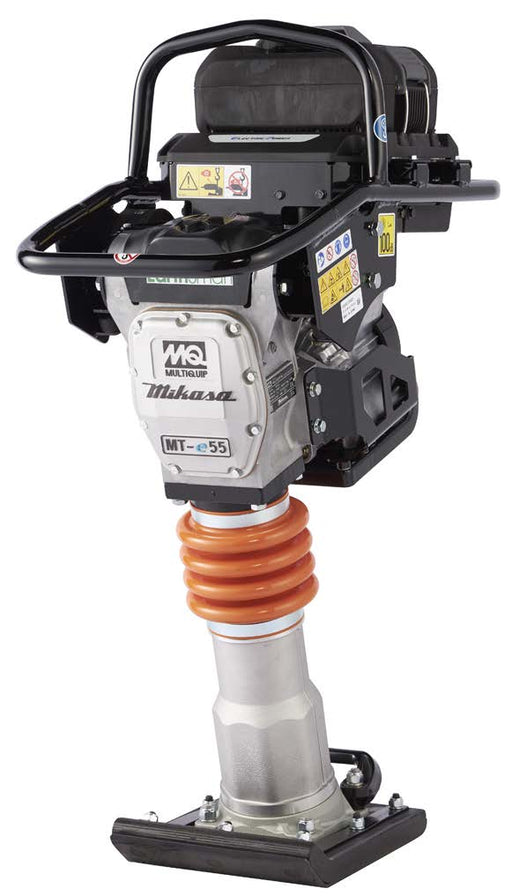 Multiquip MTe55B battery tamping rammer on a white background, black roll cage handle over a sealed motor housing marked Electric Power, aluminium gearcase carrying the MQ Multiquip and Mikasa marks and an MT-e55 badge, orange protective bellows above the ram cylinder, and a bolted laminated shoe at the base