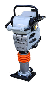 Multiquip MTX-60 tamping rammer on a white background, black tubular roll cage handle over a white engine housing, silver aluminium gearcase carrying the MQ Multiquip mark, the Mikasa script and a cast MTX-60 badge, orange protective bellows above the ram cylinder, and a bolted shoe at the base
