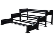 Three-level excavator bucket rack, each level a pair of tubes on stepped end frames