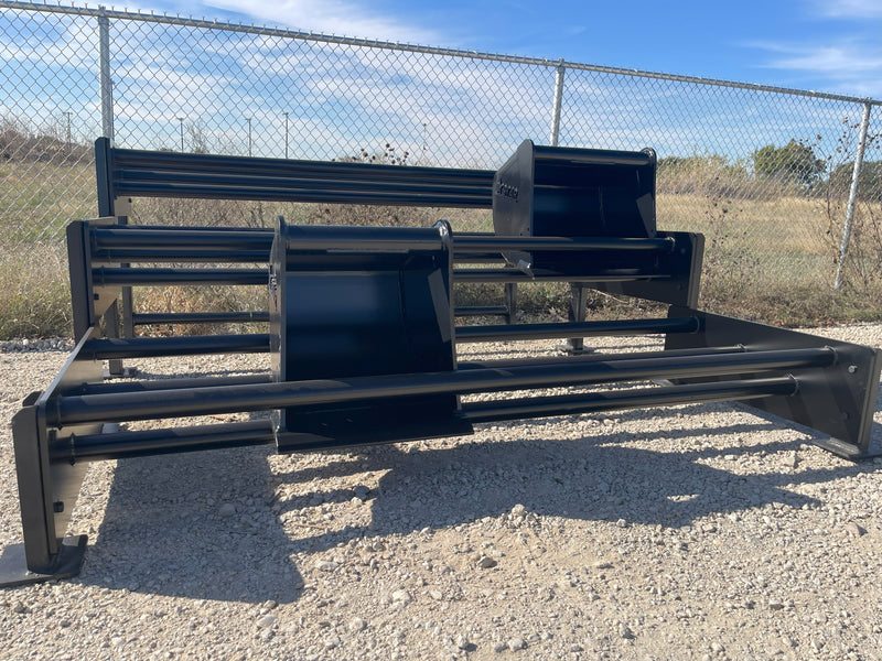 Bucket racks of different lengths lined up along a yard fence