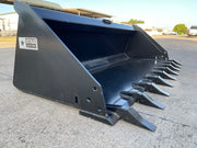 Star Industries extreme duty skid steer bucket on pavement, angled view with the pin-on tooth bank along the cutting edge