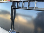 Close-up of the welded scuff bars running across the underside of the extreme duty bucket