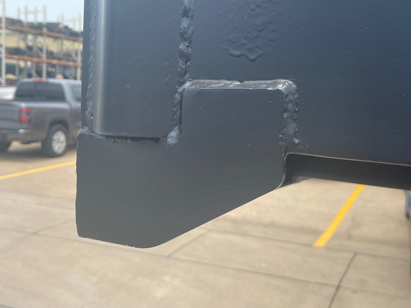 Close-up of a welded corner gusset on the hopper shell