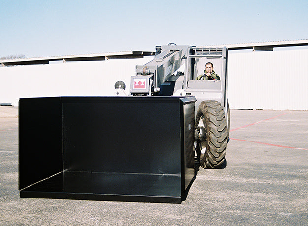 Telehandler carrying the trash hopper with the open face toward the camera
