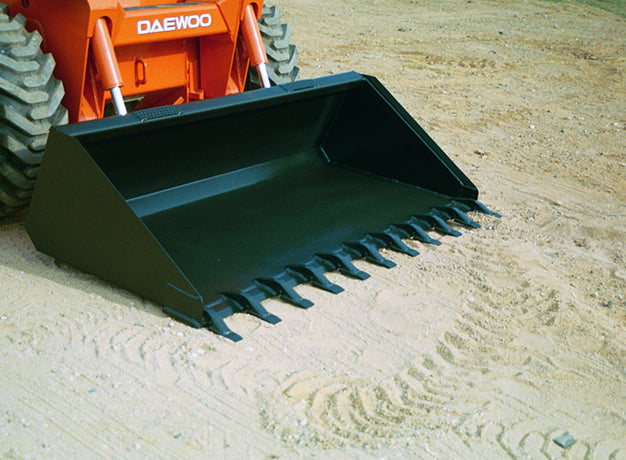 Toothed heavy duty bucket on an orange skid steer working loose sand
