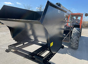 Telehandler bringing the hopper down to ground level with the operator in the cab