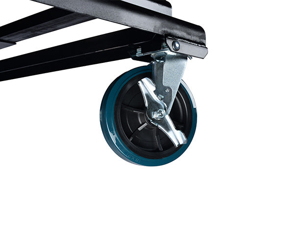 Close-up of one heavy-duty caster and its brake under the hopper base