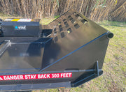 Rear quarter of the brush cutter deck showing the open back and the guard grate over the motor housing