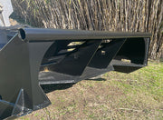 Looking into the open front of the brush cutter deck at the push bar and the reinforced side