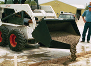 Concrete placement bucket on a white skid steer discharging concrete onto a formed slab