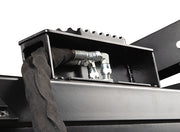 Inside the grapple bucket showing the hydraulic hoses running in their covered channel above the punched cutting edge
