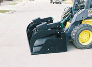 Grapple bucket on a skid steer with diamond plate arm tops closed down onto the bucket