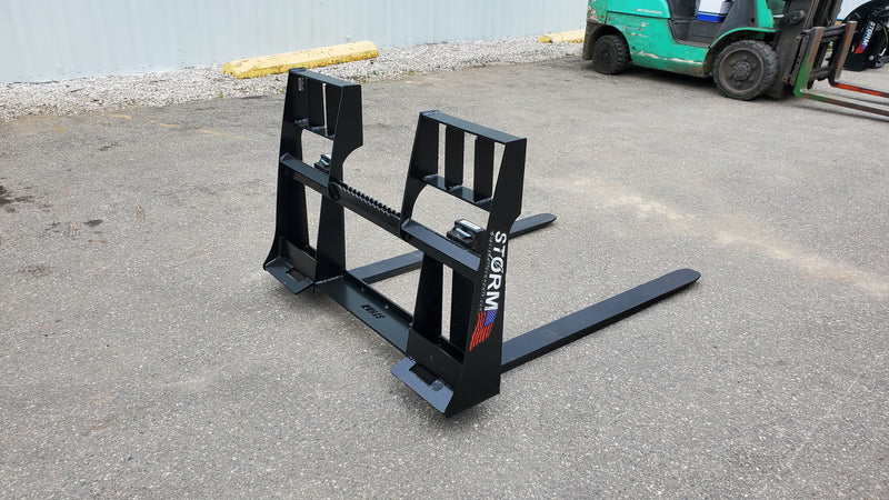 Storm 4500 pallet forks on pavement, three-quarter view of the frame and blades