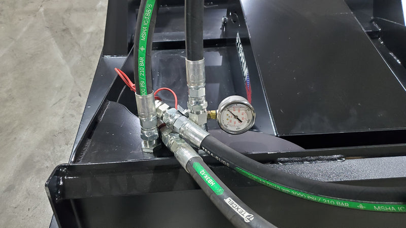 Storm 60 inch brush cutter, close view of the hydraulic hoses and the pressure gauge at the deck edge