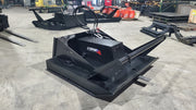 Storm 60 inch brush cutter, three-quarter view across the deck with the hydraulic lines routed to the motor