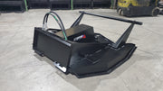 Storm 72 inch HD brush cutter on a warehouse floor, three-quarter view showing the flip-up shroud, push bar, and coiled hydraulic hoses