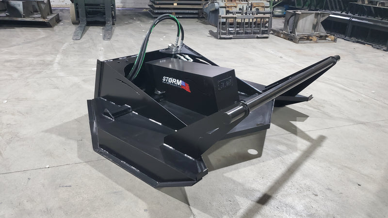 Storm 72 inch HD brush cutter on a shop floor, angled view of the deck, drive housing and push bar