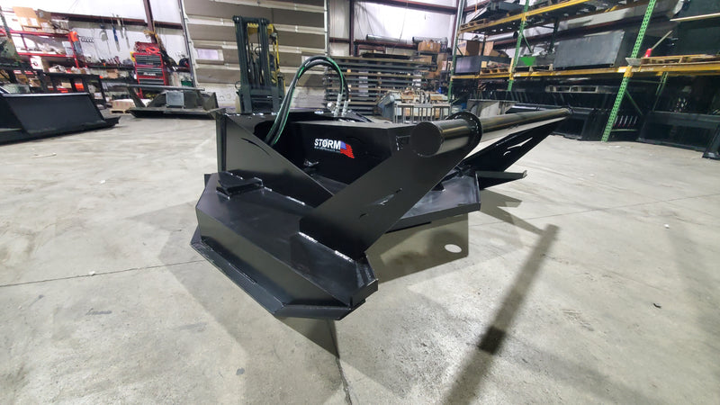Storm 72 inch HD brush cutter seen from the front, showing the deck mouth and the mount plate behind