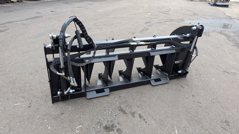 Storm 72 inch HD rake and brush grapple on pavement, angled view of the tine bar and the twin cylinders