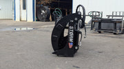 Storm 72 inch HD rake and brush grapple stood on end, side view of the curved arm profile and the stacked tines